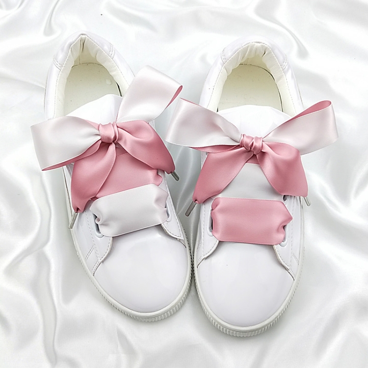 white shoes with pink shoelaces