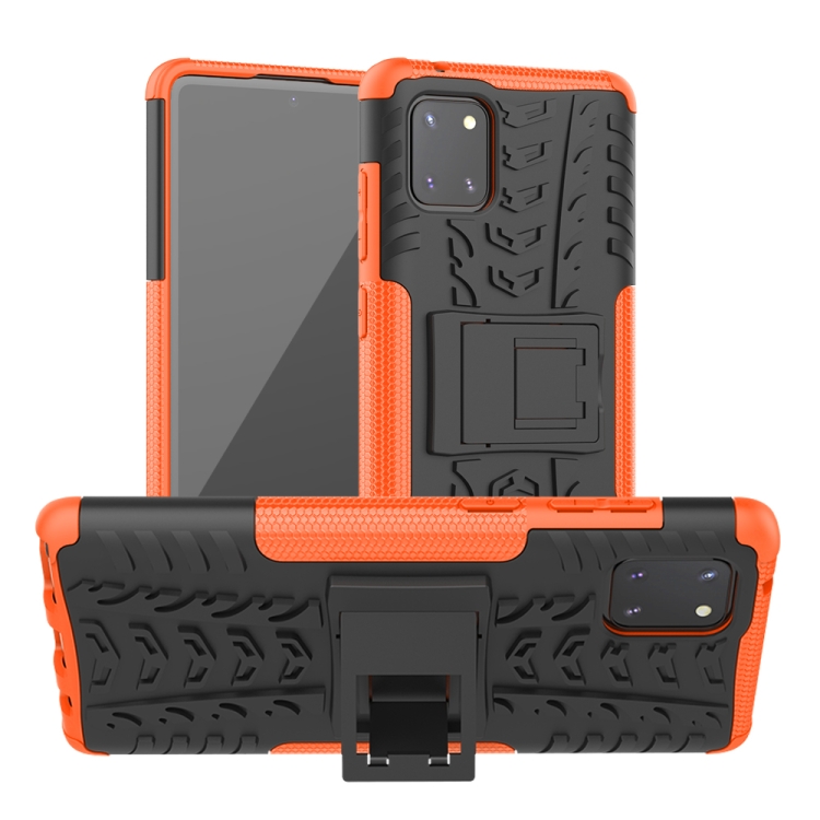 

For Galaxy Note 10 Lite Tire Texture Shockproof TPU+PC Protective Case with Holder(Orange)