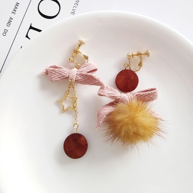 

Simple Bowknot Hairball Women Personality Asymmetry Earring(Clip Earring)